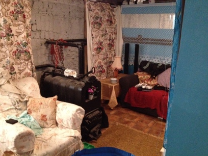 The basement was home to Aoife's House, a typical Irish granny's house. The break room was converted by adding an armchair, lace wall coverings, patterned curtains, and art.