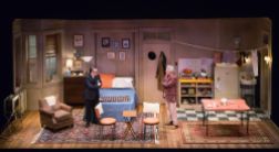 The tiny apartment set for Neil Simon's The Sunshine Boys included many practicals, including lighting, speakers, and a TV unit.